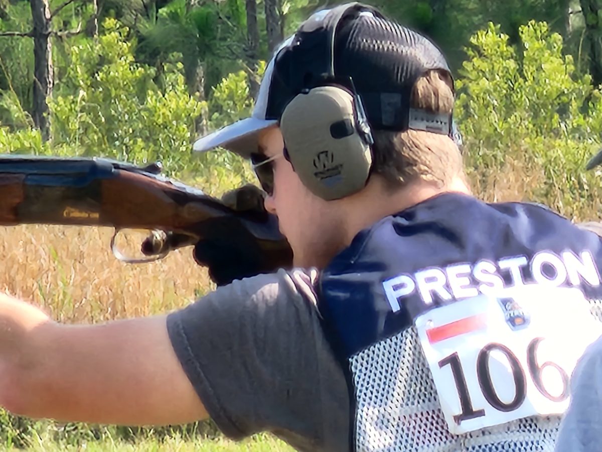 Youth shooter taking aim in competition