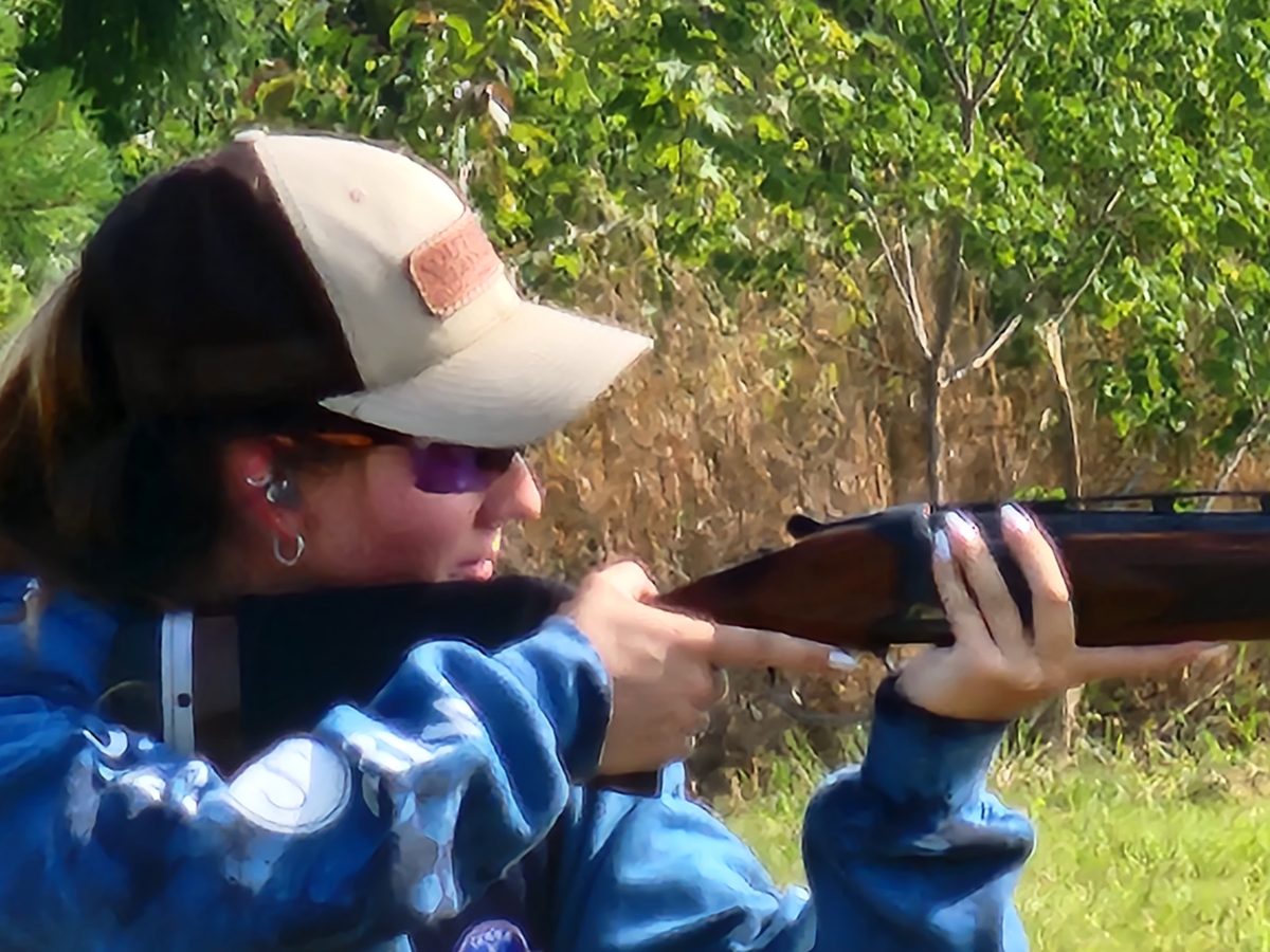 Shooter sighting a clay target